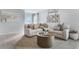 Bright and airy living room with a comfortable sectional sofa and stylish coffee table at 2563 Sage Valley Way, Winter Haven, FL 33884