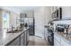 Modern kitchen with stainless steel appliances and granite countertops at 2563 Sage Valley Way, Winter Haven, FL 33884