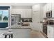 Modern kitchen with stainless steel appliances and granite countertops at 5945 Cliffbow Loop, Leesburg, FL 34748