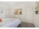 Bedroom with a queen bed, closet, and artwork at 5945 Cliffbow Loop, Leesburg, FL 34748