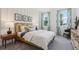 Bedroom with wood bed frame, shiplap wall, and window at 5945 Cliffbow Loop, Leesburg, FL 34748