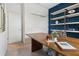 Spacious office with a large desk and storage at 5945 Cliffbow Loop, Leesburg, FL 34748