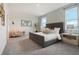 Spacious main bedroom with gray carpeting and large windows at 5945 Cliffbow Loop, Leesburg, FL 34748