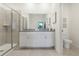 Bathroom with double vanity, granite countertops, and large shower at 5945 Cliffbow Loop, Leesburg, FL 34748