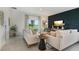 Bright and airy living room featuring comfortable seating and a modern aesthetic at 5945 Cliffbow Loop, Leesburg, FL 34748