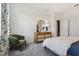 Bedroom with green chair, dresser and window at 5945 Cliffbow Loop, Leesburg, FL 34748