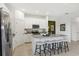 Island kitchen with stainless steel appliances and granite countertops at 5945 Cliffbow Loop, Leesburg, FL 34748