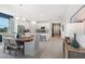 Dining room with a large wooden table and adjacent kitchen at 5945 Cliffbow Loop, Leesburg, FL 34748