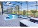 Resort-style pool and spa with screened enclosure and lounge seating at 1406 Moon Valley Dr, Davenport, FL 33896