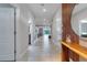 Bright and spacious entryway with tile flooring and modern wood accent wall at 1406 Moon Valley Dr, Davenport, FL 33896
