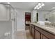 Modern bathroom with a large walk-in shower and double vanity at 1406 Moon Valley Dr, Davenport, FL 33896