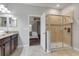 Large walk-in shower, granite countertops, and view of bedroom at 1406 Moon Valley Dr, Davenport, FL 33896