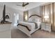 King-size bed, stylish decor, and ensuite bathroom access at 1406 Moon Valley Dr, Davenport, FL 33896