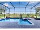 Inviting screened-in pool and spa with ample patio space at 1406 Moon Valley Dr, Davenport, FL 33896
