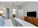 Spacious bedroom with en-suite bathroom and TV at 1406 Moon Valley Dr, Davenport, FL 33896