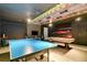 Game room with ping pong table, pool table, and race car theme at 1406 Moon Valley Dr, Davenport, FL 33896