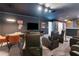 Home theater room with seating, game console, and large screen TV at 1406 Moon Valley Dr, Davenport, FL 33896