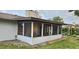 Enclosed screened porch addition with brick flooring and backyard access at 252 Cambridge Dr, Longwood, FL 32779