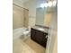 Bathroom with granite vanity and tub shower combo at 8282 Tavistock Lakes Blvd, Orlando, FL 32827