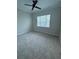 Bright bedroom with ceiling fan and carpet flooring at 8282 Tavistock Lakes Blvd, Orlando, FL 32827