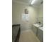 Laundry room with washer, dryer, and granite countertop at 8282 Tavistock Lakes Blvd, Orlando, FL 32827