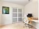Home office with built-in closet and modern workspace at 1220 Sugarwood St, Davenport, FL 33837