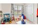 Bright playroom with built-in window seat and plenty of storage at 1220 Sugarwood St, Davenport, FL 33837