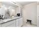 Double vanity bathroom with granite countertop and large shower at 1220 Sugarwood St, Davenport, FL 33837