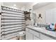 Bathroom with granite countertop, shower/tub combo, and stylish decor at 1220 Sugarwood St, Davenport, FL 33837