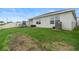 Large backyard with grassy area, playset and plenty of space at 1220 Sugarwood St, Davenport, FL 33837