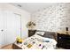 bedroom with race car themed wallpaper and built-in storage at 1220 Sugarwood St, Davenport, FL 33837