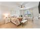 Main bedroom with plush bedding, ceiling fan, and plenty of closet space at 1220 Sugarwood St, Davenport, FL 33837