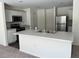 Kitchen island with double sink and white cabinets at 3402 Sw 165Th Loop, Ocala, FL 34473