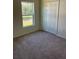 Well-lit bedroom featuring a window and closet at 3402 Sw 165Th Loop, Ocala, FL 34473