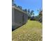 Side view of the house, showing its gray siding and AC unit at 3402 Sw 165Th Loop, Ocala, FL 34473