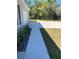 Concrete walkway leading to the house's entrance at 3402 Sw 165Th Loop, Ocala, FL 34473