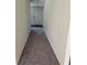 Long hallway with neutral carpeting and doors leading to rooms at 3402 Sw 165Th Loop, Ocala, FL 34473