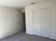 Spacious bedroom with double door closet and additional door at 3402 Sw 165Th Loop, Ocala, FL 34473