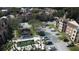 Apartment buildings, pool, parking, and landscaping at 5600 Devonbriar Way # N202, Orlando, FL 32822