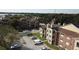 Aerial view of apartment buildings and surrounding landscape at 5600 Devonbriar Way # N202, Orlando, FL 32822