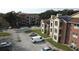 Aerial view of apartment complex with parking and a pool at 5600 Devonbriar Way # N202, Orlando, FL 32822
