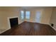 Bright living room with fireplace and patio access at 5600 Devonbriar Way # N202, Orlando, FL 32822