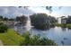 Serene community lake with fountains and lush landscaping at 5600 Devonbriar Way # N202, Orlando, FL 32822