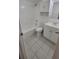 Bathroom with a bathtub, toilet, and white vanity at 5600 Devonbriar Way # N202, Orlando, FL 32822