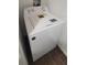 White energy-efficient top load washer at 5600 Devonbriar Way # N202, Orlando, FL 32822
