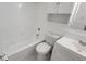 Clean bathroom with white vanity, toilet, and bathtub at 5600 Devonbriar Way # N202, Orlando, FL 32822