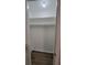 Neat closet with shelves and hanging rod at 5600 Devonbriar Way # N202, Orlando, FL 32822