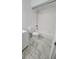 Clean bathroom with bathtub, toilet, and white tiled floor at 5600 Devonbriar Way # N202, Orlando, FL 32822