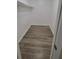 Large walk-in closet with wood-look flooring at 5600 Devonbriar Way # N202, Orlando, FL 32822