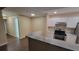 Kitchen with stainless steel appliances and granite countertops at 5600 Devonbriar Way # N202, Orlando, FL 32822